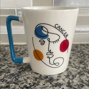 NWOT: Cancer Zodiac Mug With Abstract Face Design & Blue Handle 10 oz.